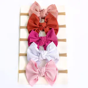 Detail of 5-pack ribbed nylon bow headbands for babies in assorted Morandi colors