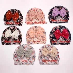 Baby floral turban hats with gold dot bows available in eight assorted colors and patterns