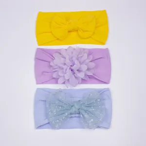 Lot de 3 bandeaux bébé avec noeud tricoté jaune, fleur violette et noeud en tulle bleu