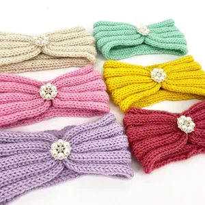 Set of six colorful knitted baby headbands with elegant pearl and rhinestone flower decor