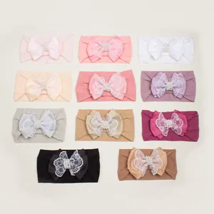 Lot de 11 bandeaux bébé colorés avec nœuds en dentelle et perles sur fond gris