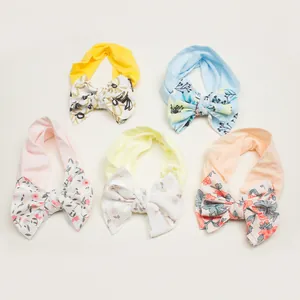 Five-piece set of soft elastic baby headbands with floral print bows in pastel colors