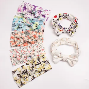 Set of 7 soft floral bow headbands for baby girls featuring elastic ribbed texture fabric