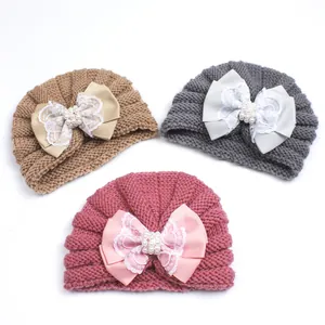 Set of 3 knitted baby turban hats with large pearl bows in khaki, gray, and pink colors