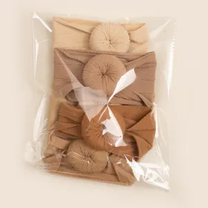 Three-piece set of jacquard donut baby headbands in warm earth tones and knit texture