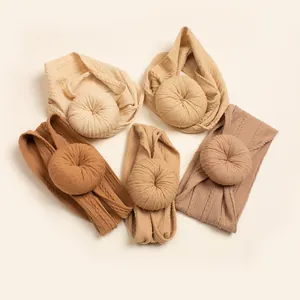 Five-pack of earthy tone cable knit baby turban headbands with decorative knots