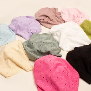 Detailed view of breathable hollow pattern knit fabrics in various trendy autumn colors