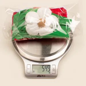 Detailed view of 3pcs Christmas baby headbands set in individual polybag weighing 54.9g
