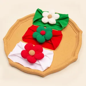 Detail of 3pcs Christmas baby headbands with corduroy flowers in red green and white