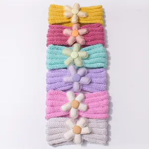 Set of six colorful knitted baby headbands with 3D floral accents for infants