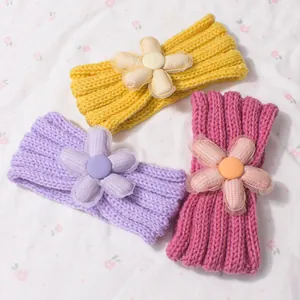 Three-piece knitted baby headbands with large floral bows in yellow, purple, and rose pink