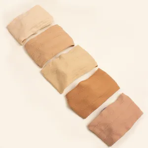 Detail of cable knit pattern on stretchy nylon baby headbands in neutral gradient colors