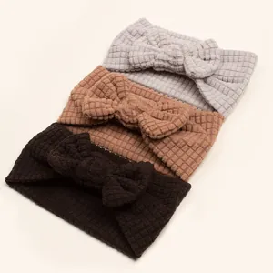 Three-pack waffle knit baby headbands with bow in grey, khaki, and brown colors