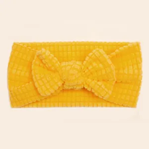 Cute yellow baby headband with large waffle texture bow for infants and toddlers