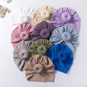 Set of 10 colorful baby turban hats with donut knots and elastic cable knit texture