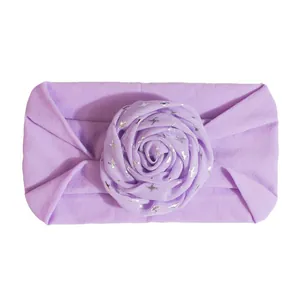 Soft purple nylon baby headband with stretchy fabric and star print rose decoration