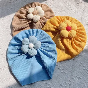 Bonnets turban pour bébé de couleur unie avec grande fleur en bleu jaune et brun