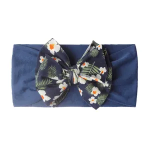 Bandeau bébé bleu marine avec nœud à imprimé floral en tissu élastique doux et respirant