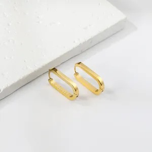Minimalist gold geometric rectangular hoop earrings with polished and brushed metal finish