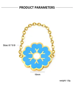 Detail of gold chain ring featuring a 15mm blue enamel flower pendant and specifications