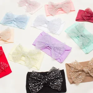 Elastic baby headbands with large mesh sequin bows in various pastel colors
