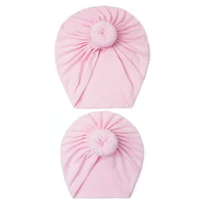 Soft pink donut knot baby turban hats in stretchy knit fabric for parent-child set