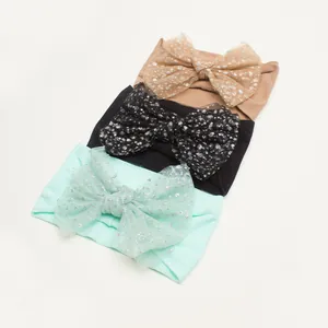 Three-piece set of baby nylon headbands with large sparkly tulle bow in various colors
