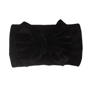 Solid black velvet baby headband featuring a large bow knot for infants and toddlers