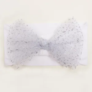 Detail of baby headband featuring a silver glitter tulle bow on a soft nylon band