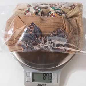 Weight measurement showing 87.3g for a set of five jacquard bow baby headbands