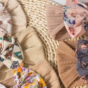 5-piece baby headband set with jacquard bows and floral prints on soft elastic fabric