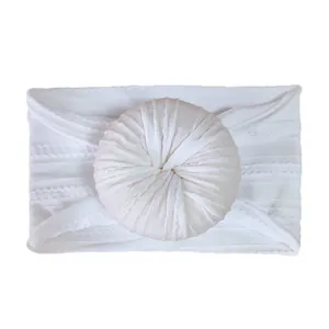 White nylon jacquard baby headband with soft donut flower bow for infants