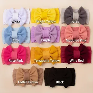 Set of 11 colorful ribbed nylon baby headbands with large bows in assorted candy colors