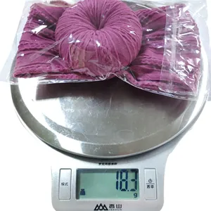 Weight measurement of purple nylon baby headband showing 18.3g on a digital scale