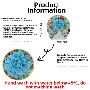Infant turban hat detail showing floral pattern, blue mesh flower, and 19x18cm dimensions