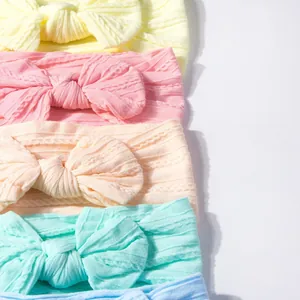 Pack of 6 colorful nylon baby headbands with large bows and knitted cable textures