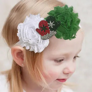 Detail of Christmas baby headband with chiffon flowers and sparkling sequin gloves