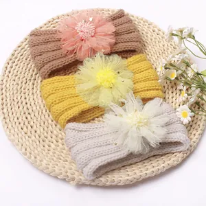 Lot de trois bandeaux tricotés pour bébé avec grandes fleurs en tulle et étoiles dorées