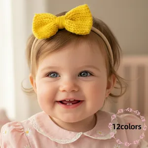 Elastic baby headband with a bright yellow knit bow for infants, available in twelve colors