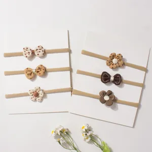 Set of 6 cute baby nylon elastic headbands with bows and flowers in earthy tones