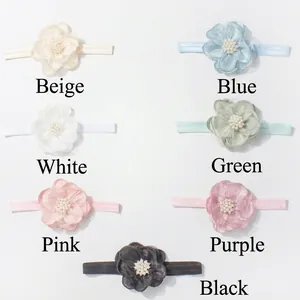 Zeven kleurrijke baby hoofdbanden met zachte tule bloemen en parels op elastische band