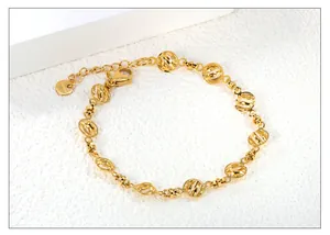 Detailed close-up of gold stainless steel geometric chain link bracelet with clasp