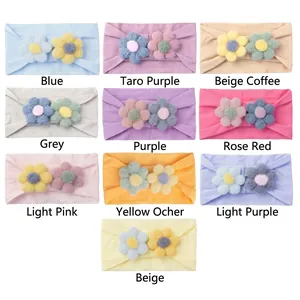 Set of 10 colors nylon baby headbands with soft plush flower decorations on white background