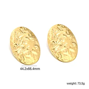 Exaggerated golden hammered texture oval earrings for women in a minimalist shield design
