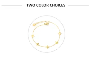 Close-up of gold stainless steel bracelet featuring delicate small airplane pendants