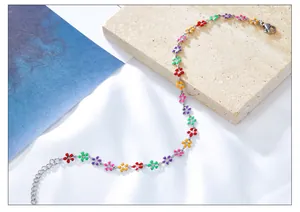 Detail of multi-color enamel flower anklet with 18k gold plating on high-quality metal