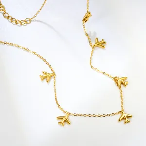 Minimalist gold chain necklace with small airplane pendants and adjustable extension chain