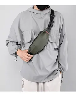 Close-up of army green waterproof crossbody chest bag with adjustable black strap and buckle