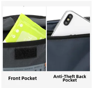 Detail of front pocket with velcro and anti-theft back zip pocket on grey waist bag