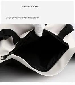 Detail view of large capacity interior pocket and sturdy strap buckle on oxford chest bag